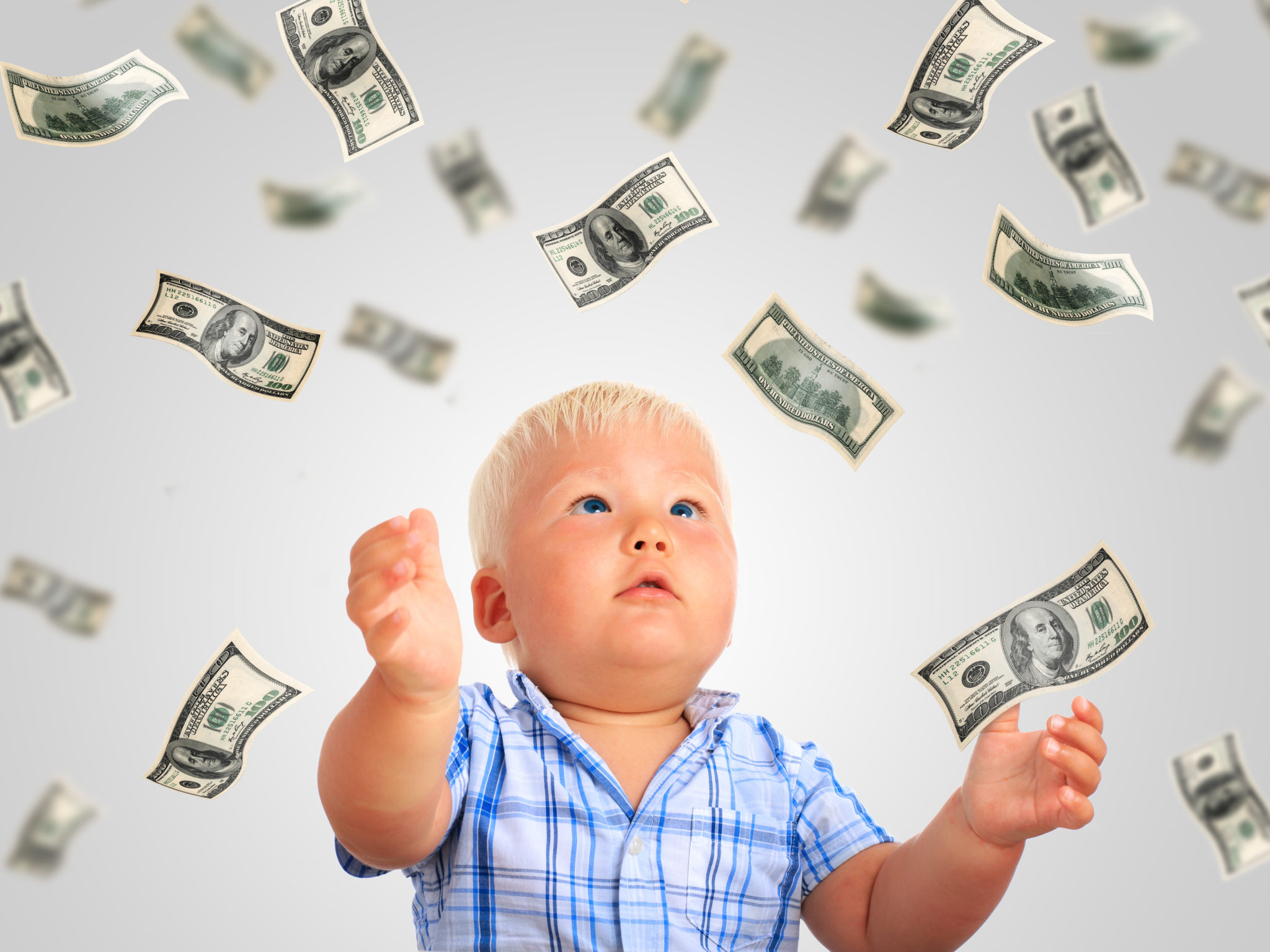 baby with flying money